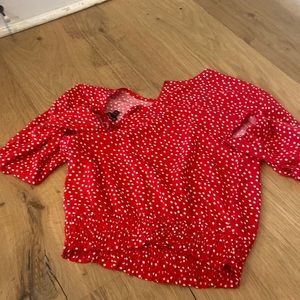 Red with white polka dots top